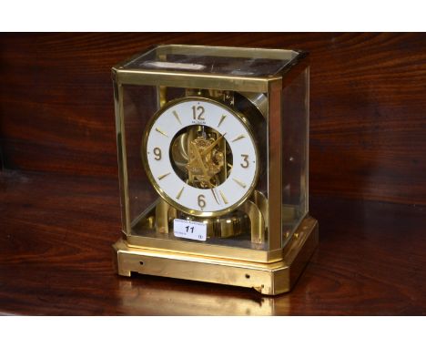 A Jaeger Le Coultre Atmos Classic VIII cal 528 brass mounted four glass mantel clock skeleton clock, 12cm white dial with Ara
