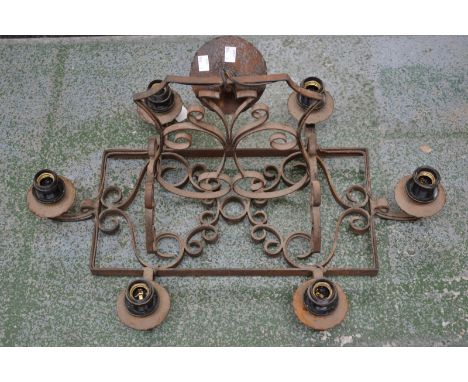 A wrought iron six light electrolier, C-scrolls.