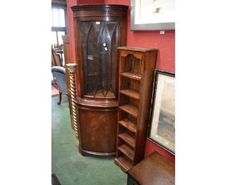 A mahogany floor standing corner cabinet; an oak glazed TV cabinet; tall dark wood shelf unit