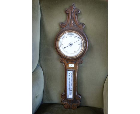 A Victorian oak barometer, circa 1890.