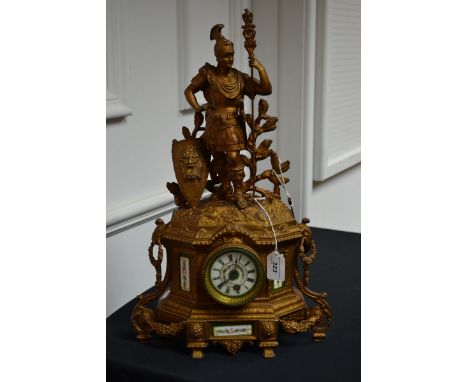 A 19th century French gilt metal figural mantel clock with Sevres style enamel panels.