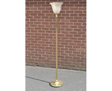 A contemporary gilt metal up-light standard lamp.