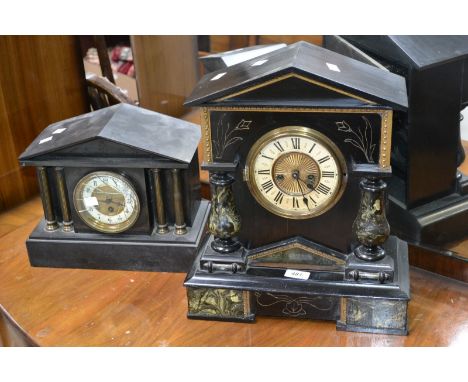 A late 19th century French architectural slate mantel clock; a similar ebonised mantel clock, arched pediment, twin winding h