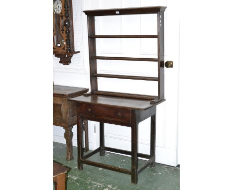 An oak lowboy circa 1800 with later four shelf dresser back. 174cm high x 92cm wide x 53cm deep.