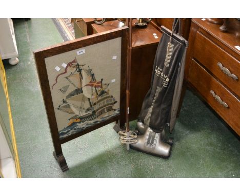 A Vintage Hoover junior; an oak framed tapestry  firescreen; a pair of Vintage ski poles