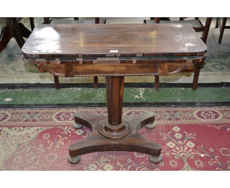 A goncalo alves card table, hinged top enclosing green baize playing area, tapering octagonal column, circular socle, incurve