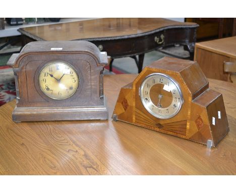 An Art Deco walnut inlaid mantel clock; an early 20th century oak mantel clock (2)