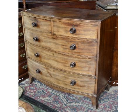 A George III bowfront chest of drawers, two short over three graduated long, spreading bracket feet. 106cm high x 107cm wide 