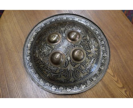 An Islamic brass, enamel and silvered shield