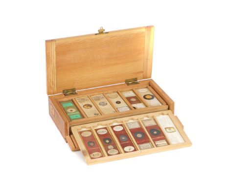 A Fine Set of Gold &amp; Silver Microscope Slide Samples, light wood flip front case with 6 trays of gold and silver samples,