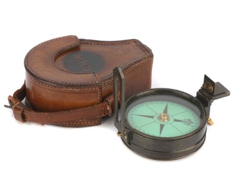A Green Card Prismatic Compass, English, c.1885, in oxidised brass, signed Lawrence &amp; Mayo London, glass diameter 7cm, wi