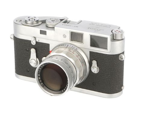 A Leica M2 'Attrappe' Rangefinder Camera, 1957-67, chrome, serial no. 13064A, with Leitz Summicron f/2 50mm lens, body, VG, s