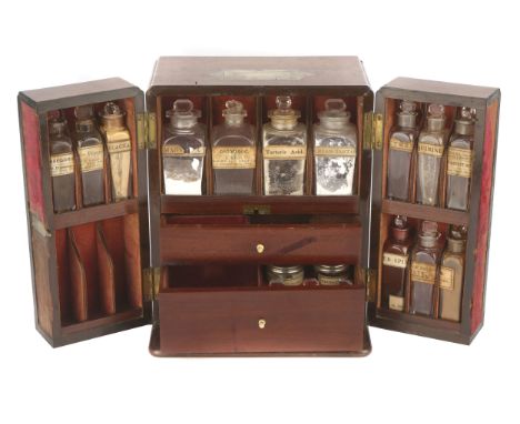 A Good Mid-Victorian Domestic Apothecary Chest, English, c.1840, double doors open to reveal space for 16 original bottles (t