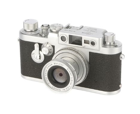 A Leica IIIg Rangefinder Camera, 1959, chrome, serial no. 956496, with Leitz Elmar f/2.8 50mm lens, 1958, chrome, serial no. 