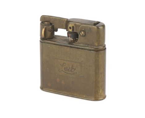 A Brass Cigarette Lighter,  engraved 'Leitz'