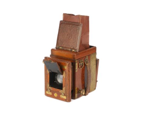 A Thornton Pickard Ruby Reflex Tropical 6.5x9cm Camera, 1920-30, teak, with Ross Xpres f/3.5 136mm lens, serial no. 126129, b