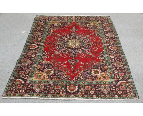 A TABRIZ CARPET. 307cm by 199cm