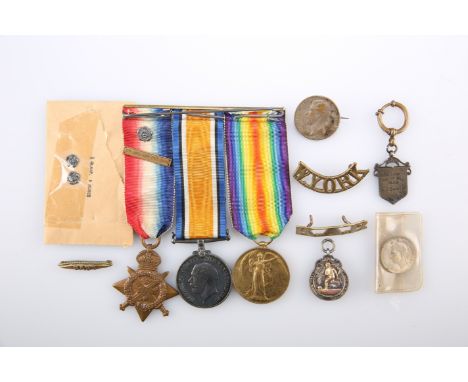 A MONS STAR TRIO, 8341 CPL E.J. Baber Glouc. R; together with various fobs and badges including silver football medal.