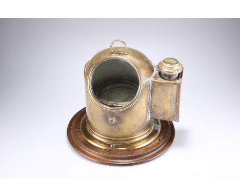A BRASS BINNACLE SHIP’S COMPASS, the floating compass card in a drum case with gimbal mount under a brass binnacle with light