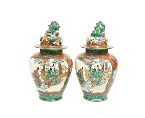 A PAIR OF CHINESE PORCELAIN VASES AND COVERS, LATE 19TH CENTURY, baluster form, the domed covers with fu dog finials, enamel 