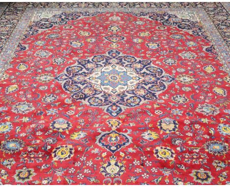 A KASHAN CARPET. 410cm by 305cm