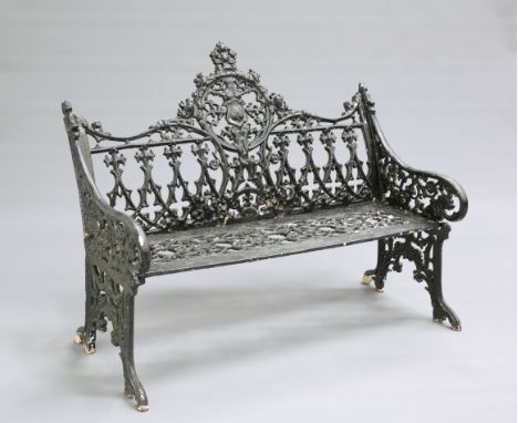 A VICTORIAN COALBROOKDALE STYLE CAST IRON GARDEN BENCH, in Gothic style. 97cm high, 119cm long