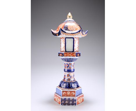 A JAPANESE MEIJI PERIOD IMARI TEMPLE LANTERN, with hexagonal base, cylindrical pedestal, and pagoda-style top with onion fini