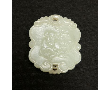 A CHINESE CELADON JADE PENDANT, carved to one side with a figure holding a vase, the other side with a seal type tablet. 5.2c