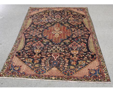 A KASHAN CARPET. 309cm by 177cm