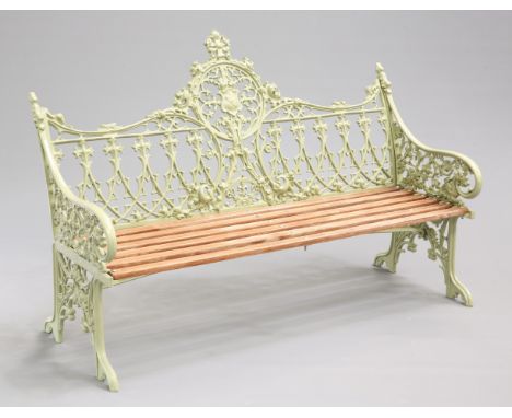 A COALBROOKDALE STYLE GREEN PAINTED GARDEN BENCH, cast with a shield within Gothic tracery and flower ornament, with slatted 