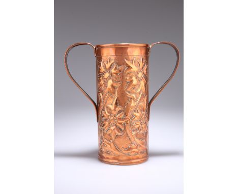 A LARGE ARTS AND CRAFTS COPPER TWO-HANDLED VASE, cylindrical, repousse with stylised flowerheads, scratched signature R. Reid