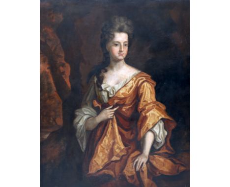 FOLLOWER OF SIR PETER LELY (1618-1680), PORTRAIT OF A LADY WEARING A WHITE CHEMISE AND AN OCHRE GOWN, oil on canvas, framed. 