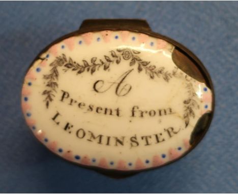 18th/19th C enamel oval patch box with internal mirror, the top marked 'A Present From Leominster' (4.5cm x 3.5cm x 2.5cm) (c