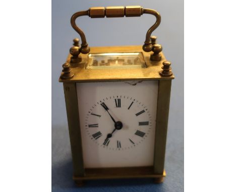 Small brass French eight day carriage clock with key (with beveled glass panels) (front panel missing and chip to face) (heig