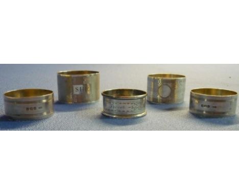 Pair of Birmingham silver hallmarked napkin rings with engine turn detail and three other various silver hallmarked napkin ri