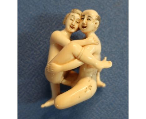 Early 20th C carved ivory erotic Netsuke with signature panel to the buttock (height 4.5cm) 