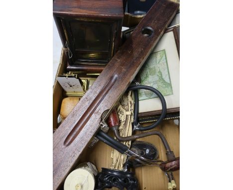 Box containing various clock parts, part carriage clock, pictures, prints, vintage brace and spirit level with broad arrow 19