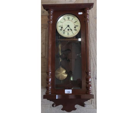 Modern mahogany cased chiming wall clock 