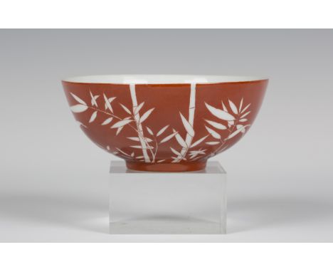 A Chinese white on coral ground hemispherical porcelain bowl, mark and period of Daoguang, the iron red exterior painted in w