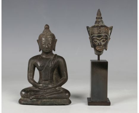 A Thai bronze Buddha head, 17th/18th century, height 6.9cm, mounted on a black metal pedestal, together with a Thai bronze se