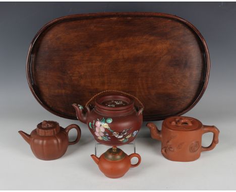 A Chinese famille rose enamelled Yixing stoneware teapot and cover, late Qing dynasty, the squat circular body decorated with