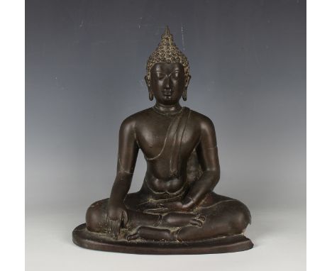 A Thai brown patinated bronze Buddha, 19th century, modelled seated in dhyanasana, height 31cm (base damaged). Provenance: fr