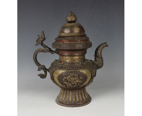 A Tibetan copper teapot and domed cover, 19th century, the baluster body with partially gilded decoration, applied with a pai