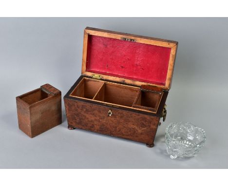 AN EARLY VICTORIAN AMBOYNA TEA CADDY, of sarcophagus form, gilt metal ring handles to sides, bun feet, the interior with two 