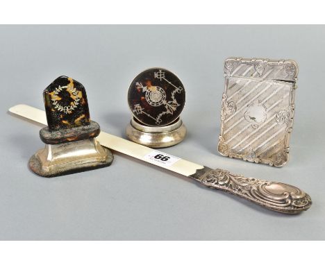 FOUR ITEMS OF VICTORIAN AND EARLY 20TH CENTURY SILVER WARE, comprising a Victorian card case of wavy rectangular outline, eng