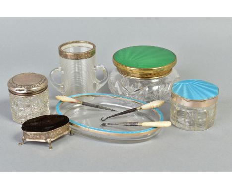 A GROUP OF SILVER MOUNTED DRESSING TABLE JARS, ETC, including a pin cushion of oval form and a glass tyg with silver rim, tog