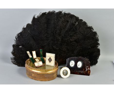 A DYED BLACK OSTRICH FEATHER FAN, having tortoiseshell handle, with a 'Seychells' carved tortoiseshell double picture frame, 