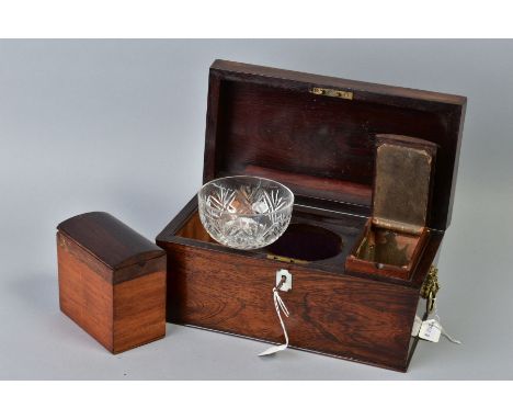 AN EARLY VICTORIAN ROSEWOOD TEA CADDY, of sarcophagus form, gilt metal lion mask and ring side handles, interior fitted with 