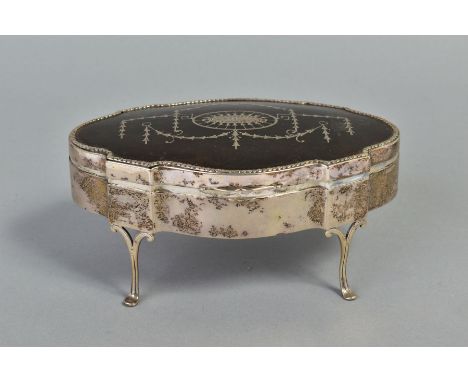 A GEORGE V SILVER AND TORTOISESHELL PIQUE WORK TRINKET BOX, shaped oval outline, husking border, the hinged cover inlaid with