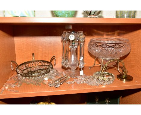 A VICTORIAN GLASS LUSTRE, wavy rim surrounding candleholder, facet cut baluster pedestal with petal shaped foot, two droppers